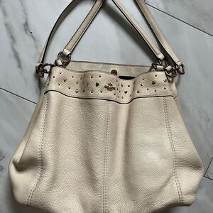Used Coach Sun/Moon/Stars leather handbag - would benefit from cleaning.